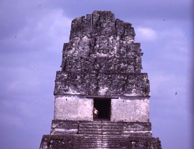 Tikal, man in doorway