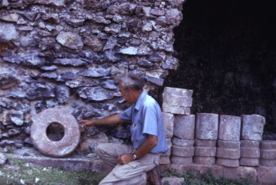 Chacmultun, George examining building feature