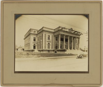 Scottish Rite Cathedral (Dallas, Tex.): exterior view of front entrace with car, corner perspective
